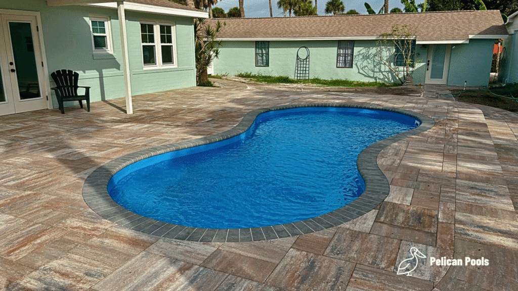 Cocoa Beach pool for water aerobics, laps, and activities, installed by Pelican Pools in Volusia County with a custom paver deck.