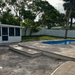 Cocoa Beach fiberglass swimming pool installed by Pelican Pools in Volusia County with a custom paver deck.