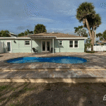 San Juan Pools Cocoa Beach model installed outdoors by Pelican Pools in Volusia County with a custom paver deck.