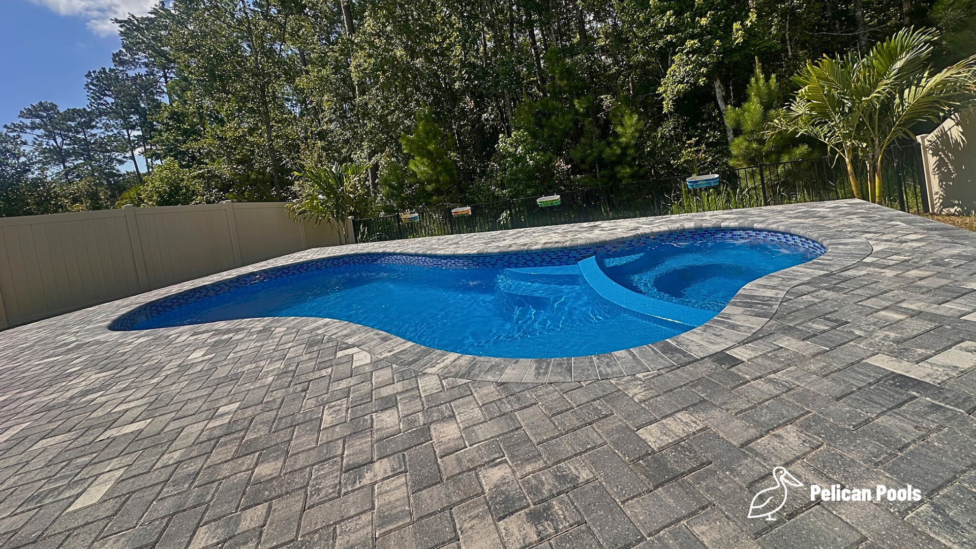 Mandalay Bay pool and spa creating a complete backyard retreat, Installed by Pelican Pools and fast installation.