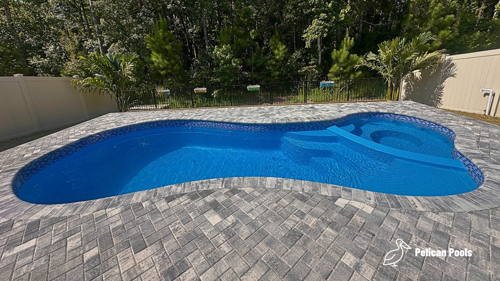 Mandalay Bay pool with smooth fiberglass surface that resists algae, Installed by Pelican Pools and fast installation.