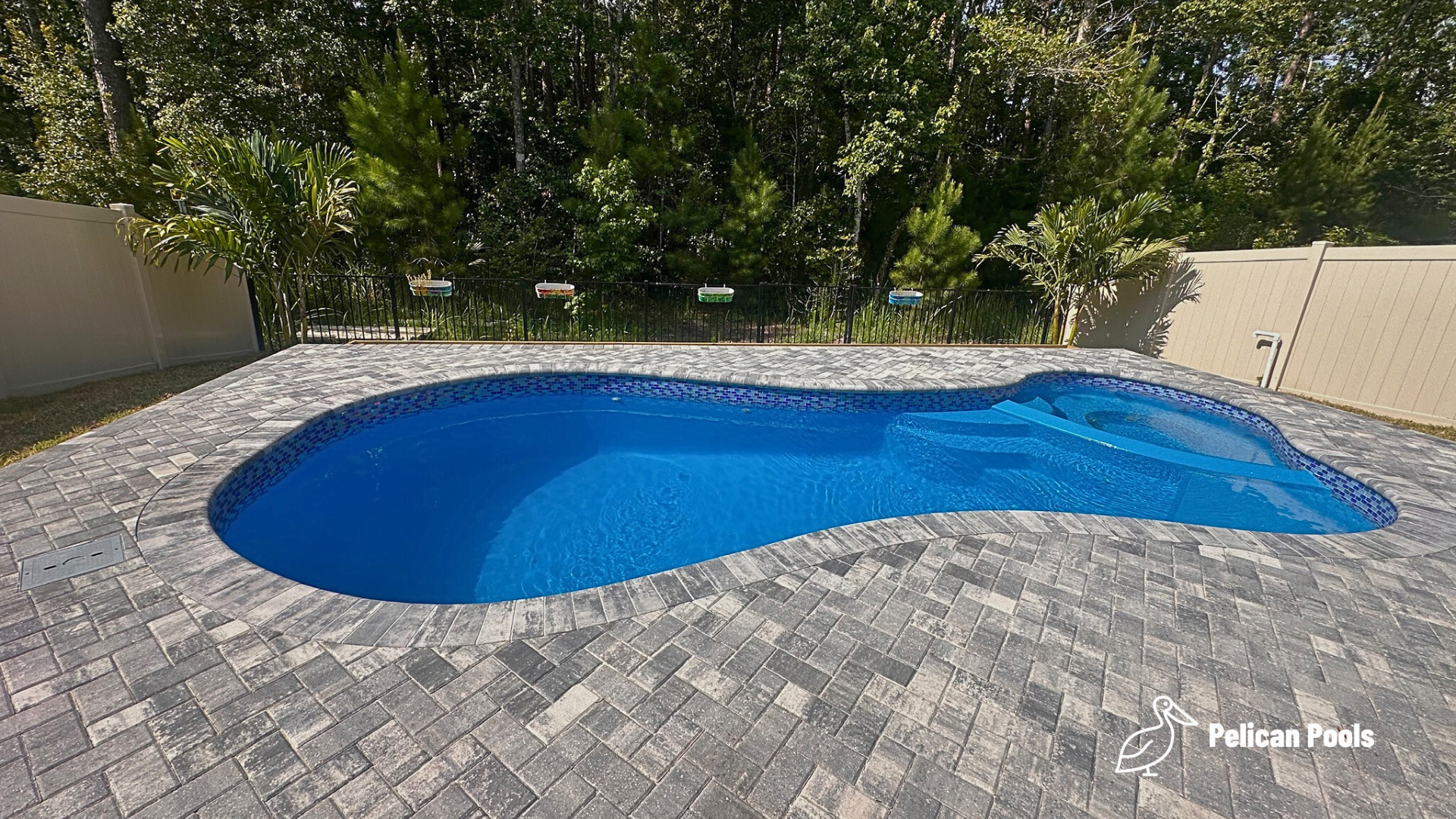 Mandalay Bay pool fitting a small to medium yard with graceful curves, Installed by Pelican Pools and fast installation.