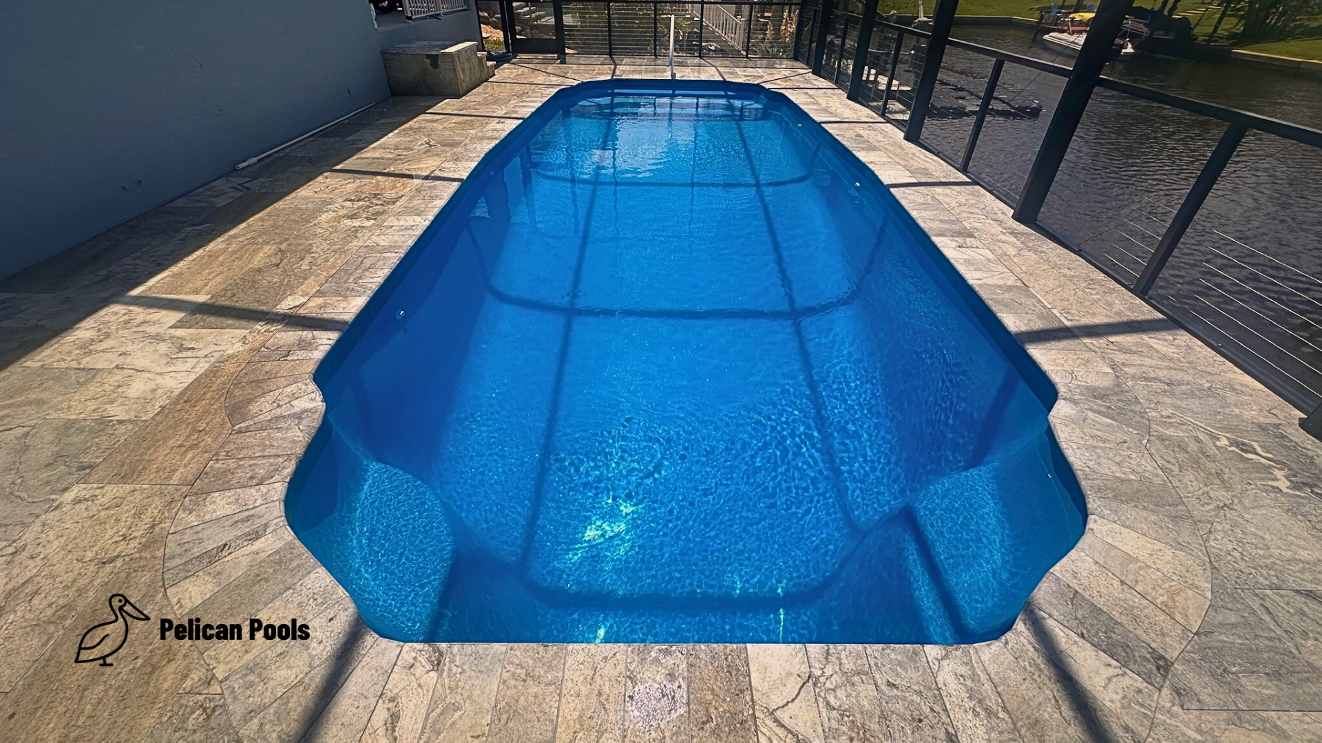 The Hawaiian fiberglass pool with wide shallow entry steps and clear swim lane, Installed by Pelican Pools and fast installation.