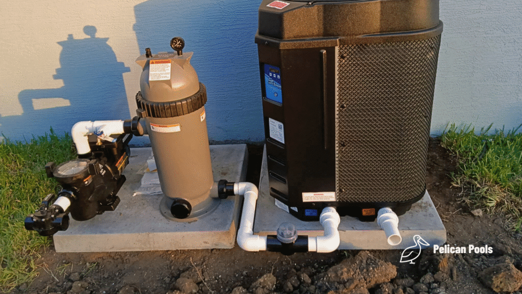 Pool pump, cartridge filter, and GulfStream heat pump installed on concrete pad.