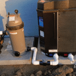 Pool pump, cartridge filter, and GulfStream heat pump installed on concrete pad.