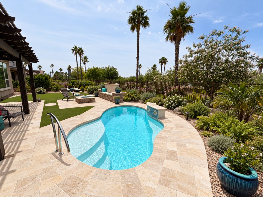 Edited design inspiration showing a Crystal Cove pool beside a pergola with limestone paving, entry rail and palm garden.
