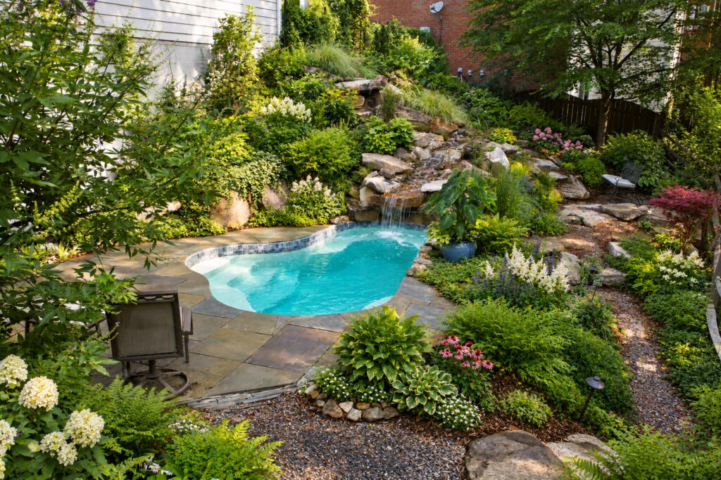 Crystal Springs garden pool with natural flagstone paving and a rock waterfall. Digitally edited design inspiration.
