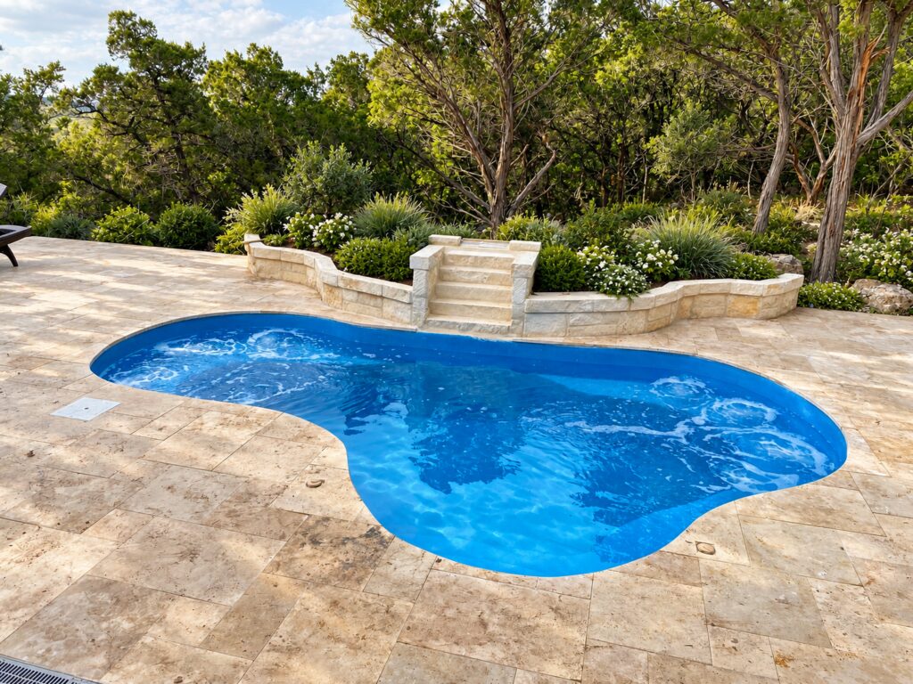 Blue Crystal Springs pool with natural stone patio and planted woodland borders. Digitally edited design inspiration.