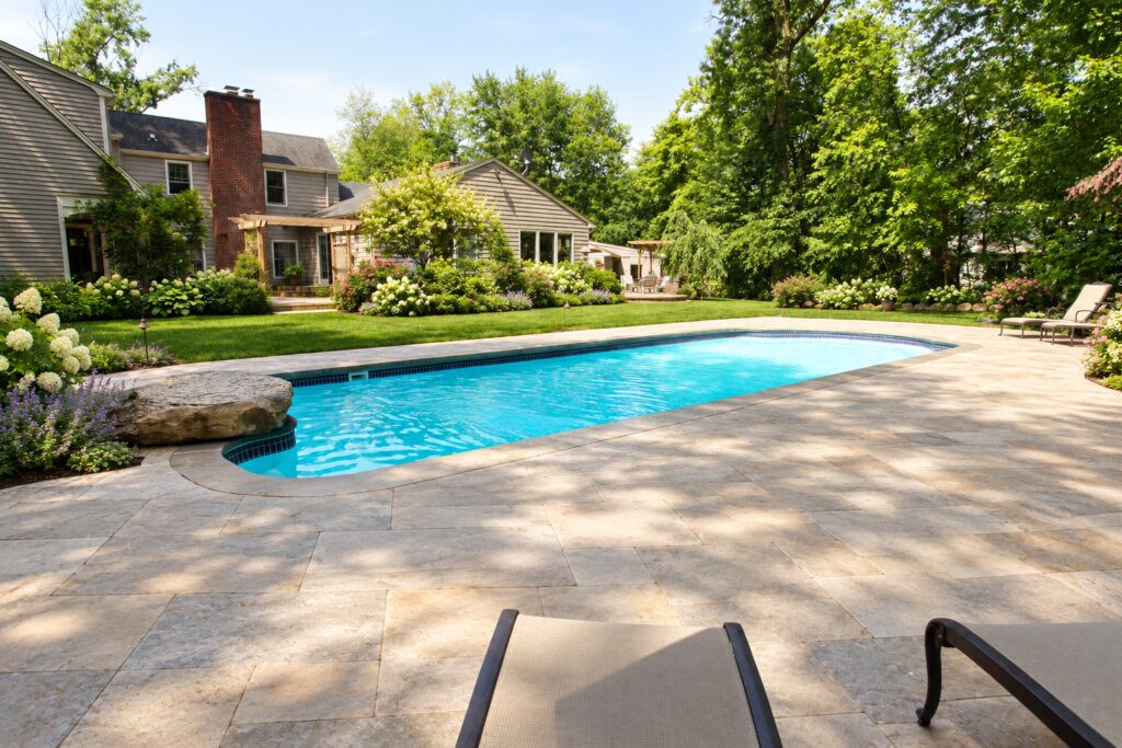 Dallas pool with a rock feature in a landscaped cottage garden. Digitally edited design inspiration.