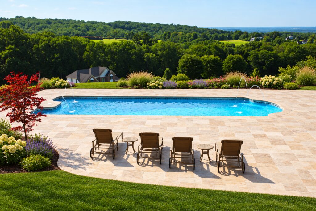 Dallas pool overlooking wooded hills with travertine paving and landscaped borders. Digitally edited design inspiration.