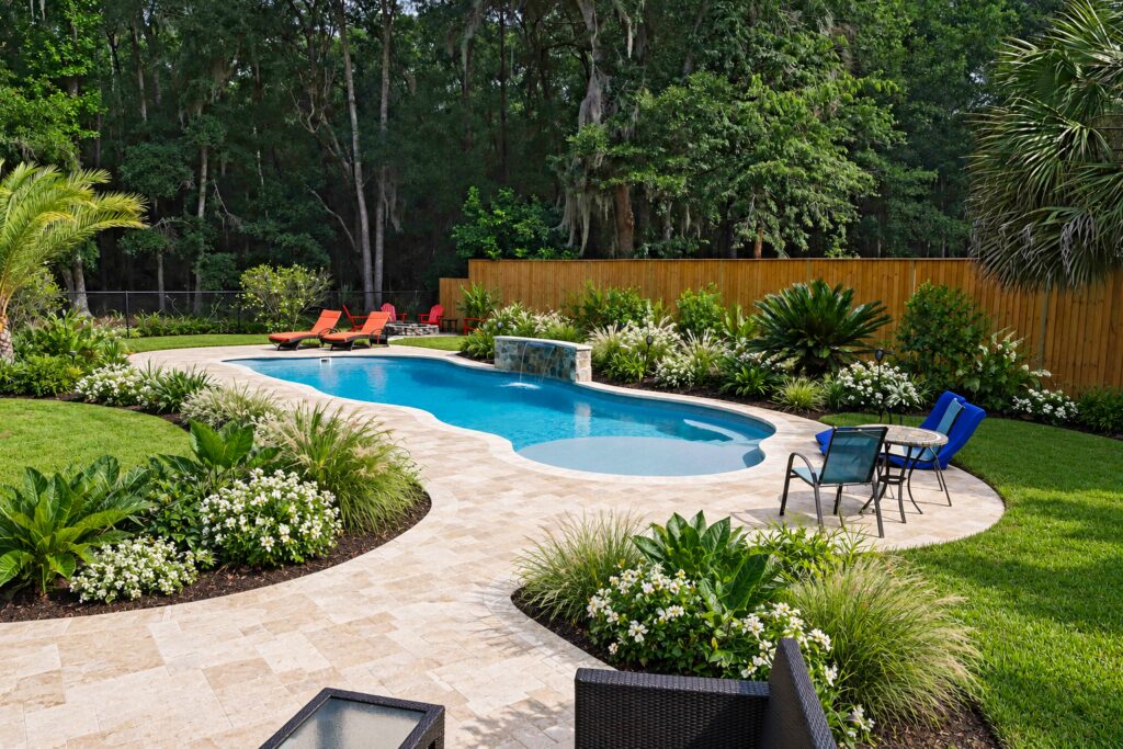 San Juan Daytona Beach Pool – Coastal Travertine Design Inspiration Daytona Beach pool with coastal planting and travertine patio. Digitally edited design inspiration.