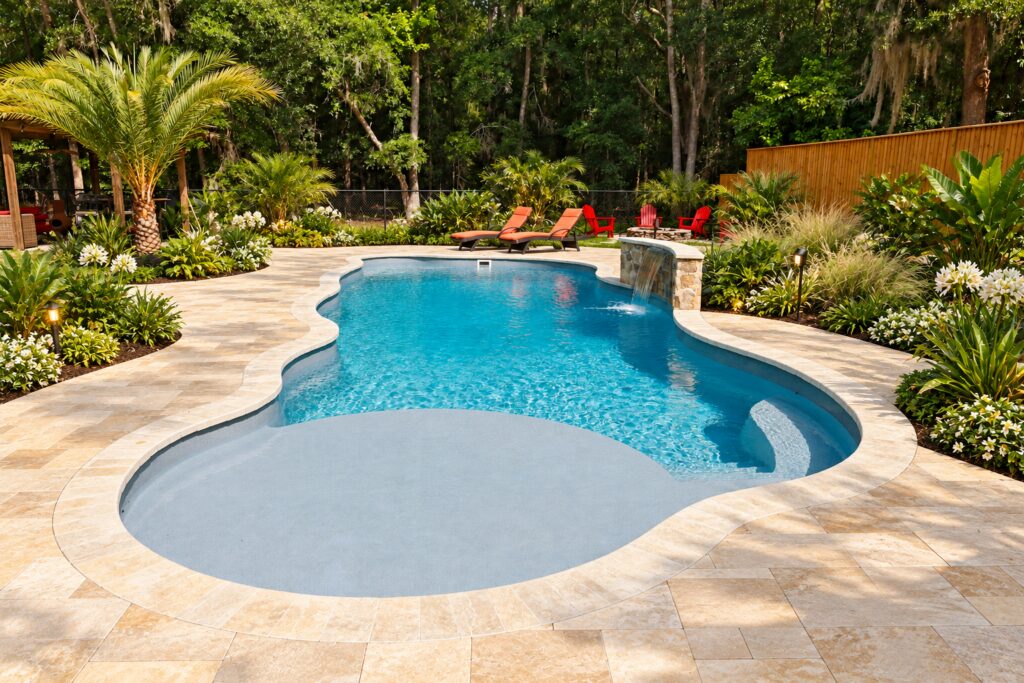 San Juan Daytona Beach Pool – Sun Shelf Stone Design Inspiration Daytona Beach pool with a broad shallow sun shelf, curved step and natural stone patio. Digitally edited design inspiration.